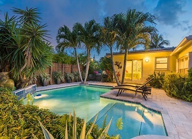 The Floridian House backyard pool at night; one of the most unique things to do in Fort Lauderdale