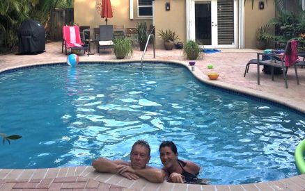 two people sitting in pool