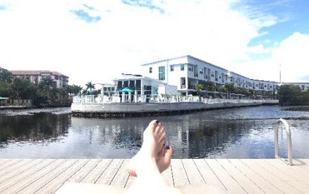 person laying on a dock