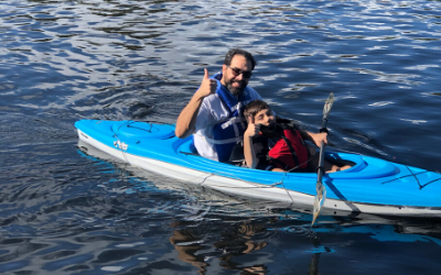 man and boy in a kayak